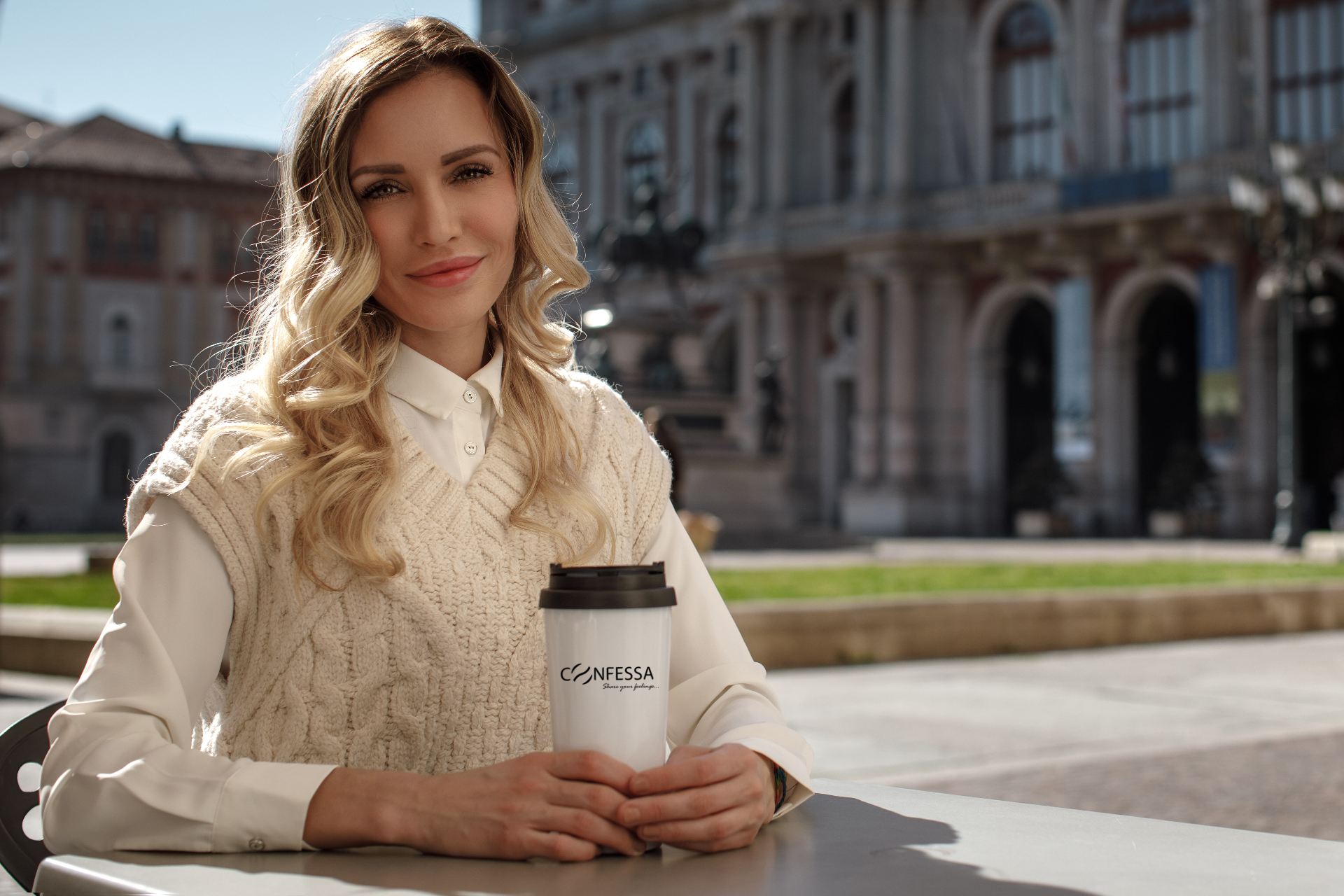 Woman with a Confessa takeaway cup in a European piazza