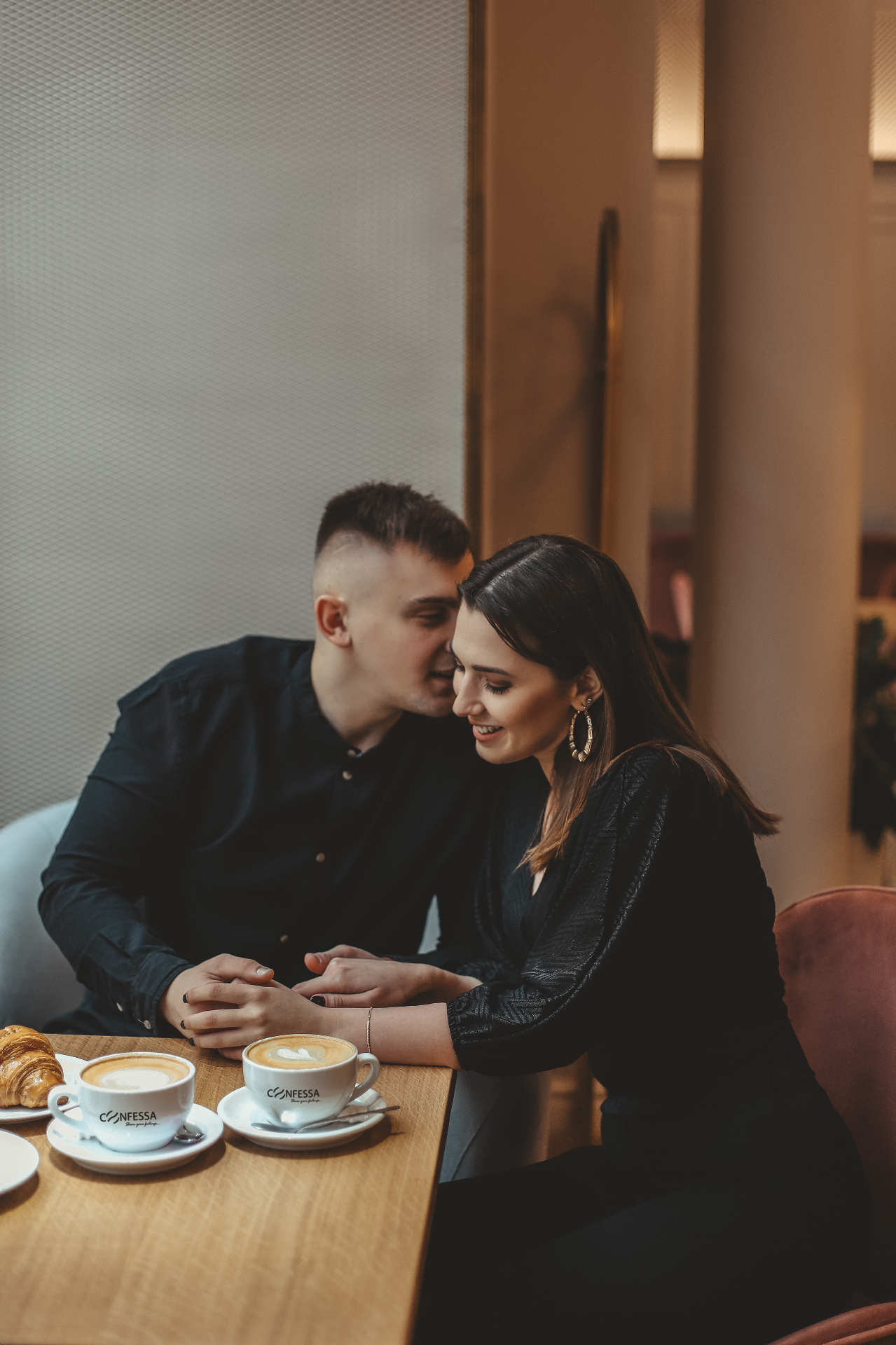 A couple sharing a Confessa cappuccino